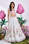 Buy_Nea by Nikita Tiwari_White Raw Silk Hand Embroidered Lotus Plunge Lehenga Set With Cape_at_Aza_Fashions