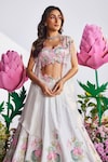 Shop_Nea by Nikita Tiwari_White Raw Silk Hand Embroidered Lotus Plunge Lehenga Set With Cape_Online_at_Aza_Fashions