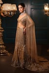 Isa By Dolly Wahal_Gold Net Hand Embroidery Sequins V-neck Celeste Fishcut Trail Lehenga Set _at_Aza_Fashions