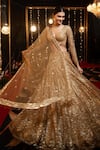 Buy_Isa By Dolly Wahal_Gold Net Hand Embroidery Sequin V-neck Icarus Lehenga Set _at_Aza_Fashions