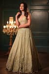 Shop_Isa By Dolly Wahal_Green Net Hand Embroidery Sequins Plunged V-neck Feather Pistachio Lehenga Set _at_Aza_Fashions