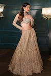 Shop_Isa By Dolly Wahal_Gold Net Hand Embroidery Sequins Off-shoulder Geometric Lehenga Set _at_Aza_Fashions