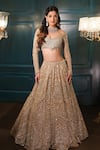 Buy_Isa By Dolly Wahal_Gold Net Hand Embroidery Sequins Off-shoulder Geometric Lehenga Set _Online_at_Aza_Fashions