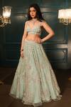 Buy_Isa By Dolly Wahal_Green Net Hand Embroidery Sequins V-neck 3d Floral Lehenga Set _at_Aza_Fashions