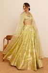 Buy_Studio Iris India_Green Silk Woven Sequin Plunge V-neck Fressia Lehenga Set_at_Aza_Fashions