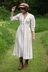 Shop_The Terra Tribe_Yellow Linen Printed Striped V Neck Flared Dress _at_Aza_Fashions