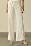 Somya Goyal_White Microfibre Faille- 95% Pvc Solid Flared Cargo Trouser _Online_at_Aza_Fashions