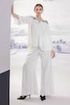 Buy_Orthodox_White Banana Crepe Flared Solid Trouser _at_Aza_Fashions