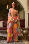 Buy_DiyaRajvvir_Peach Crepe Print Floral Blouse V-neck Cape Flared Pant Set _at_Aza_Fashions