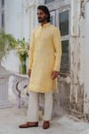 Buy_Amrit Dawani_Yellow Raw Silk Embroidery Mirror Phool Vine Kurta With Pant _Online_at_Aza_Fashions