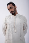 KAKA CALCUTTA_Ivory Kurta Bam Silk Embellished Mirrorwork Wave With Pyjama _at_Aza_Fashions