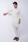 KAKA CALCUTTA_Ivory Kurta Bam Silk Embellished Mirrorwork Hem With Pyjama _at_Aza_Fashions