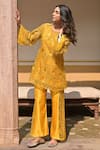 Buy_Tarisha Tholia_Yellow Organza Hand Embroidered Thread Cutwork Round Marigold Kurta Set _at_Aza_Fashions