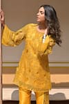 Shop_Tarisha Tholia_Yellow Organza Hand Embroidered Thread Cutwork Round Marigold Kurta Set _at_Aza_Fashions