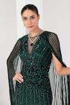 AKARA_Green Tulle Embellished Cutdana Illusion Sheer Round Neck Floral Stripe Gown _at_Aza_Fashions