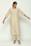 Buy_ABRAHAM AND THAKORE_Beige Chanderi Calligraphy Round Neck Cutwork A Line Kurta _at_Aza_Fashions