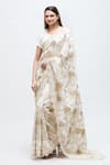 Buy_Nakita Singh_Off White Chanderi Embroidered Sequin Leaf Neck Zari Saree With Blouse _at_Aza_Fashions