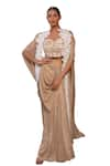 Label Anshu Khathuria_Gold Crushed Lycra Embroidered Floral Slit Sleeve Cape With Draped Skirt Set _at_Aza_Fashions