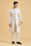 Shop_Arihant Rai Sinha_Cream Brocade, Polyester Embroidery Star Pattern Sherwani With Churidar_Online_at_Aza_Fashions