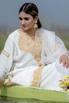 Daljit Sudan White Crepe And Organza Tilla Notched Embroidered Phiran Kurta Pant Set at Aza Fashions Daljit Sudan_White Crepe And Organza Tilla Notched Embroidered Phiran Kurta Pant Set _at_Aza_Fashions