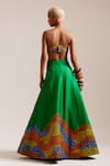 Shop_MINI SONDHI_Green Raw Silk Embroidered Thread Flowering Garden Lehenga With Tube Bralette _at_Aza_Fashions