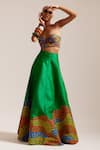 MINI SONDHI_Green Raw Silk Embroidered Thread Flowering Garden Lehenga With Tube Bralette _at_Aza_Fashions