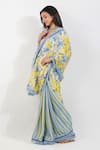 Devyani Mehrotra_Yellow Crepe Printed Vintage Floral Stripe Saree With Unstitched Blouse Piece _Online_at_Aza_Fashions