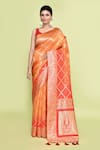 Buy_Samyukta Singhania_Orange Banarasi Silk Woven Foil Print Saree With Unstitched Blouse Piece _at_Aza_Fashions