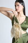 Tasna_Gold Cutdana Cosmic Haze Tassel Potli Bag _at_Aza_Fashions