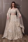 Buy_SAYISHA_Off White Organza Hand Embroidered Sequins Sweetheart Floral Lehenga Set _at_Aza_Fashions