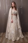 Shop_SAYISHA_Off White Organza Hand Embroidered Sequins Sweetheart Floral Lehenga Set _Online_at_Aza_Fashions