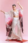 Buy_Dolly J_White Satin Embellished Pearl Cape Amaya Watercolour Print Flared Pant Set _at_Aza_Fashions