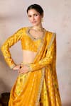 Masaba_Yellow Raw Silk Print Pixie Dust Nomadic Tribe Leaf Neck Lehenga Set _at_Aza_Fashions