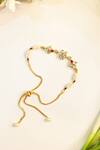 Buy_Shlok Jewels_White Pearls, Rhinestones Floral Kundan Rakhi _at_Aza_Fashions