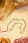 Buy_Shlok Jewels_Green Crystals, Gemstones Kundan Embellished Rakhi And Lumba Set _at_Aza_Fashions