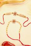 Buy_Shlok Jewels_White Crystals, Gemstones Kundan And Semi-precious Rakhi Set _at_Aza_Fashions