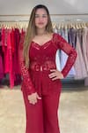 Shop_K&A By Karishma and Ashita_Red Net Embroidery Glass Bead Broad V Neck Carmine Jacket Flared Pant Set _at_Aza_Fashions