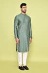 Shop_Arihant Rai Sinha_Green Silk Embellished Mirrorwork Stripe Kurta With Churidar _Online_at_Aza_Fashions