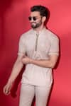 Buy_AMIT ARORA_Beige Poly-knit Textured Threadwork Straight T-shirt _at_Aza_Fashions