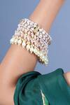 Shop Queens Jewels Gold Plated Pearls, Stones Kundan Tassel Bangle Set at Aza Fashions Shop_Queens Jewels_Gold Plated Pearls, Stones Kundan Tassel Bangle Set _at_Aza_Fashions