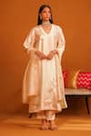 Buy_OMANA BY RANJANA BOTHRA_Beige Kurta And Trouser Cotton Satin Applique Floral V Neck Jasmine Set _at_Aza_Fashions