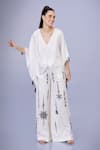 Buy_DILNAZ_Ivory Blended Satin Embellished Feather V Neck Bead Border Draped Kaftan _at_Aza_Fashions