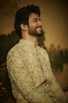 Mrunalini Rao_Yellow Sherwani Raw Silk Embroidered Resham And Pearl Work Nevan Set _at_Aza_Fashions