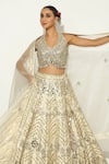 Buy_Vandana Sethi_Gold Shimmer Raw Silk Embellished Mirrorwork Halter Neck Floral Lehenga Set _Online_at_Aza_Fashions