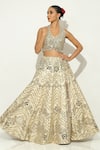 Shop_Vandana Sethi_Gold Shimmer Raw Silk Embellished Mirrorwork Halter Neck Floral Lehenga Set _Online_at_Aza_Fashions