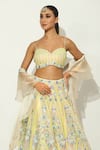 Buy_Vandana Sethi_Ivory Shimmer Organza Embellished Sequin Floral Vine Bead Bridal Lehenga Set _Online_at_Aza_Fashions