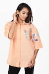 Buy_Richaa Goenka_Peach Cotton Print Text Collared Neck Holographic Life Shirt _at_Aza_Fashions
