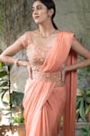 Pooja Kankariya_Peach Chiffon Embellished Crystal Cutwork Border Saree With Blouse _at_Aza_Fashions