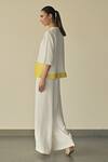 Shop_Somya Goyal_White Microfibre Faille- 95% Landscape Hem Top And Stella Flared Trouser Set _at_Aza_Fashions