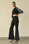 Buy_Somya Goyal_Black 95% Viscose Blend Solid Gradated Bell Bottom Trouser _Online_at_Aza_Fashions